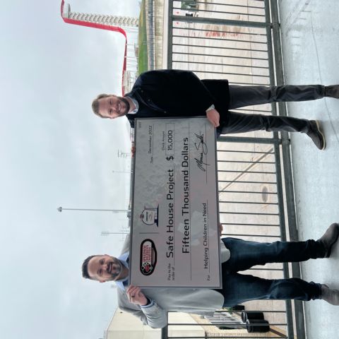 NASCAR at COTA Executive Director Bryan Hammond (left) presents a $15,000 check from Speedway Children’s Charities to Chris Hargis of Safe House Project (right) as a result of fundraising during the March 25-27, 2022 NASCAR weekend at Circuit of The Americas in Austin, Texas.
