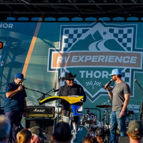 NASCAR Cup Series driver Corey LaJoie (far right) helped auction off an autographed quarter panel from one of his race cars during the Live Auction to benefit Speedway Children’s Charities during last month’s NASCAR at COTA weekend in Austin, Texas.