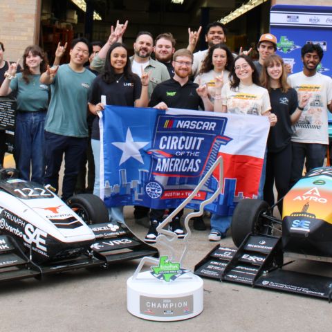NASCAR Cup Series driver and defending EchoPark Automotive Grand Prix winner Tyler Reddick of 23XI Racing (center) visits Longhorn Racing on the University of Texas campus Thursday in Austin, Texas.